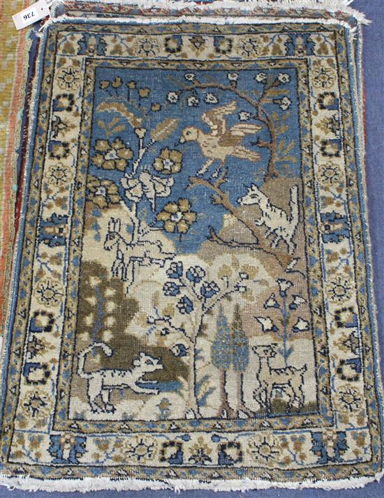 A pair of Persian blue ground small mats, decorated with animals amongst trees and flowers, and three other mats with stylised floral